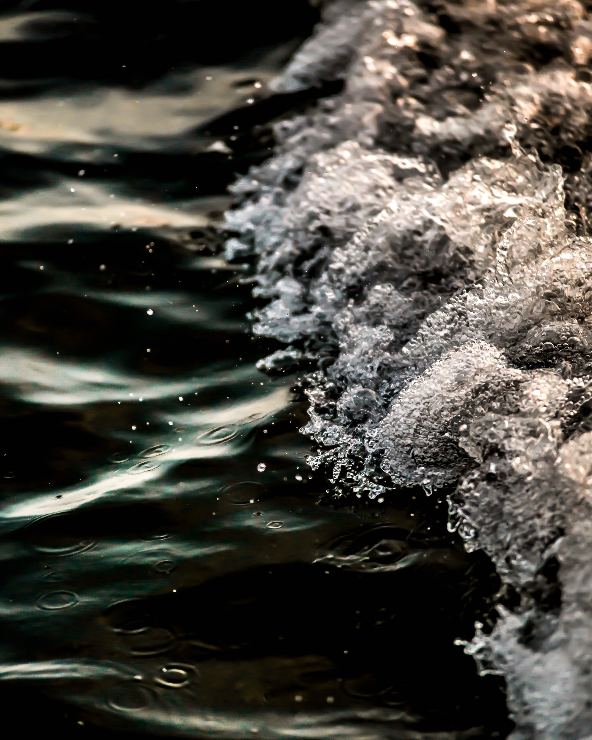 opposing calm and churning waters meeting to create a stark line