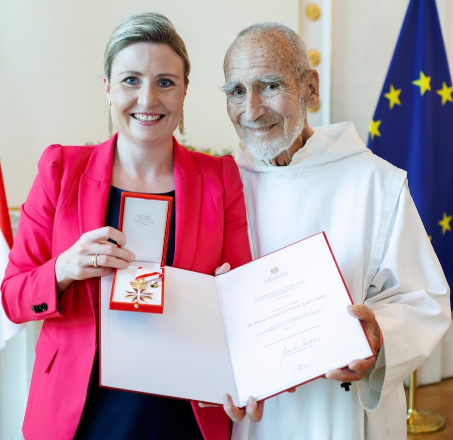 Br. David Steindl-Rast receiving the Golden Decoration of Honor for special services to the Republic of Austria as presented by Susanne Raab