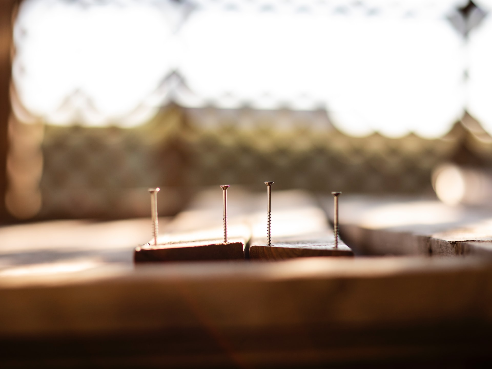 Four thin screws on wood