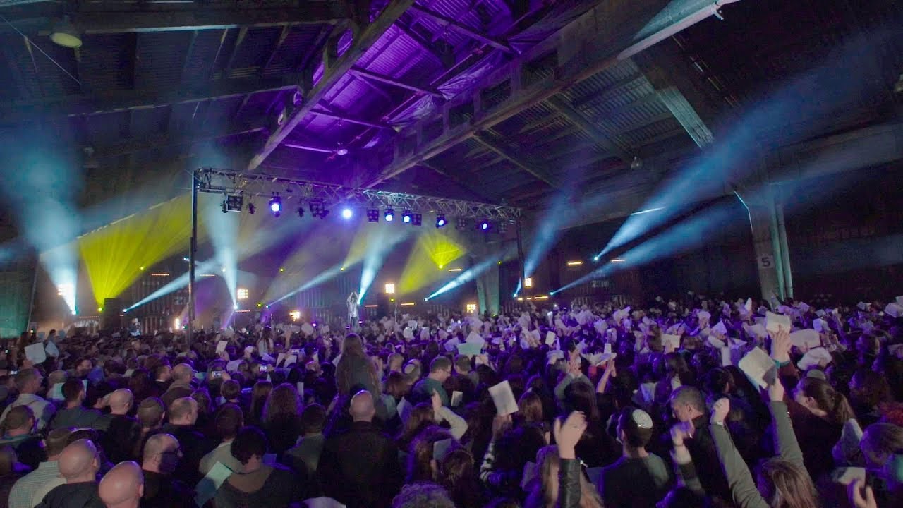Crowd of people gathered singing