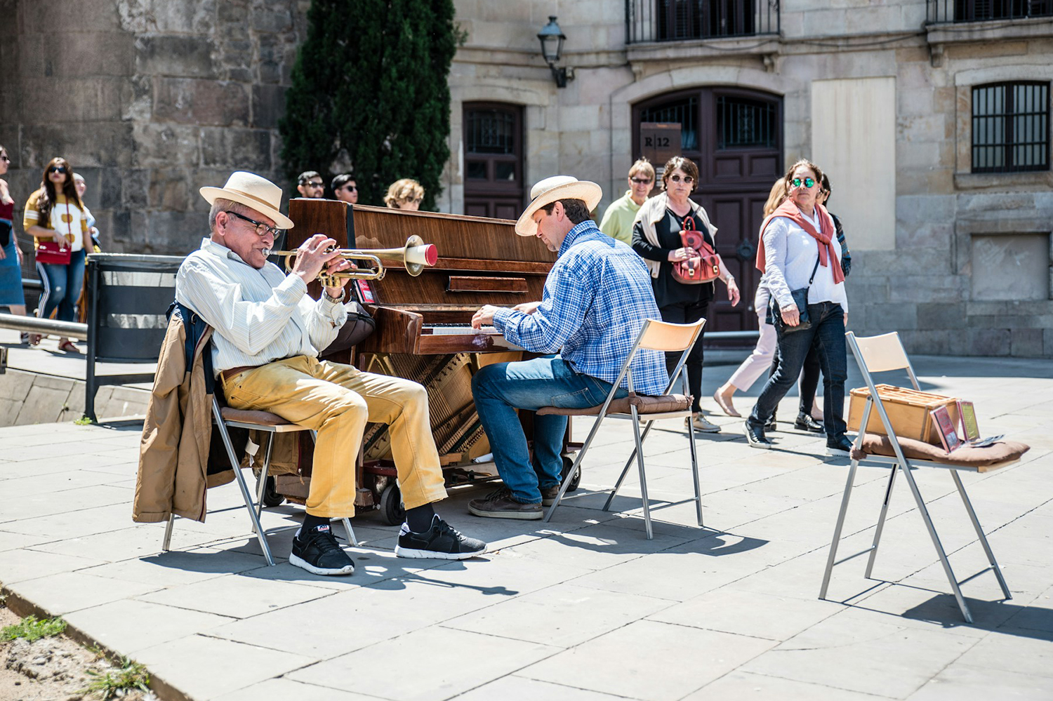 street musicians performing while people walk by