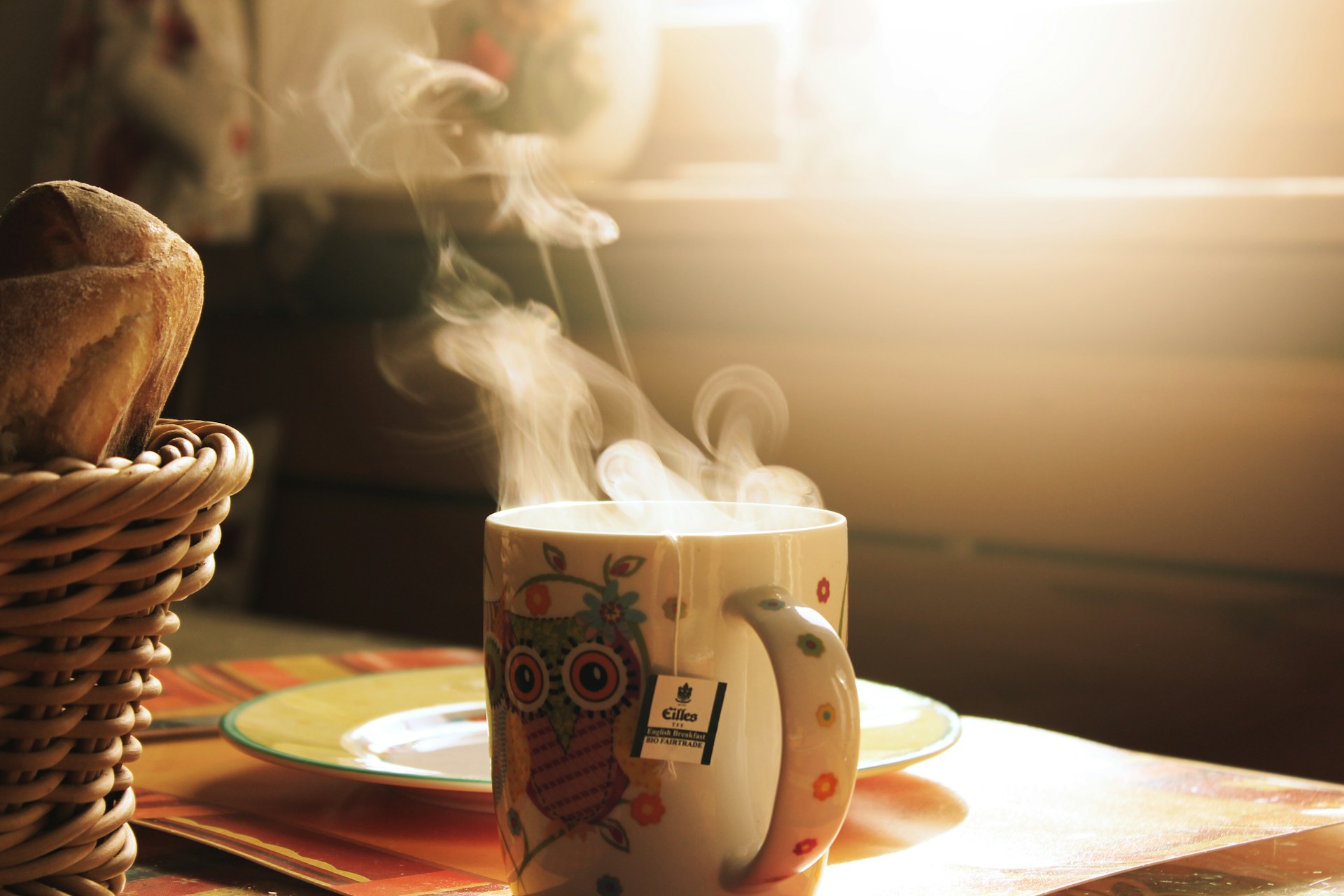 Steam rising from a mug of tea in morning light