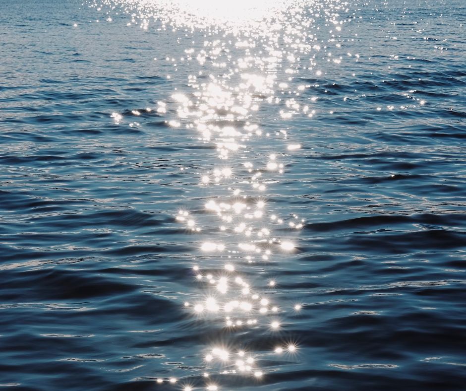 Sunlight reflecting on dark blue water